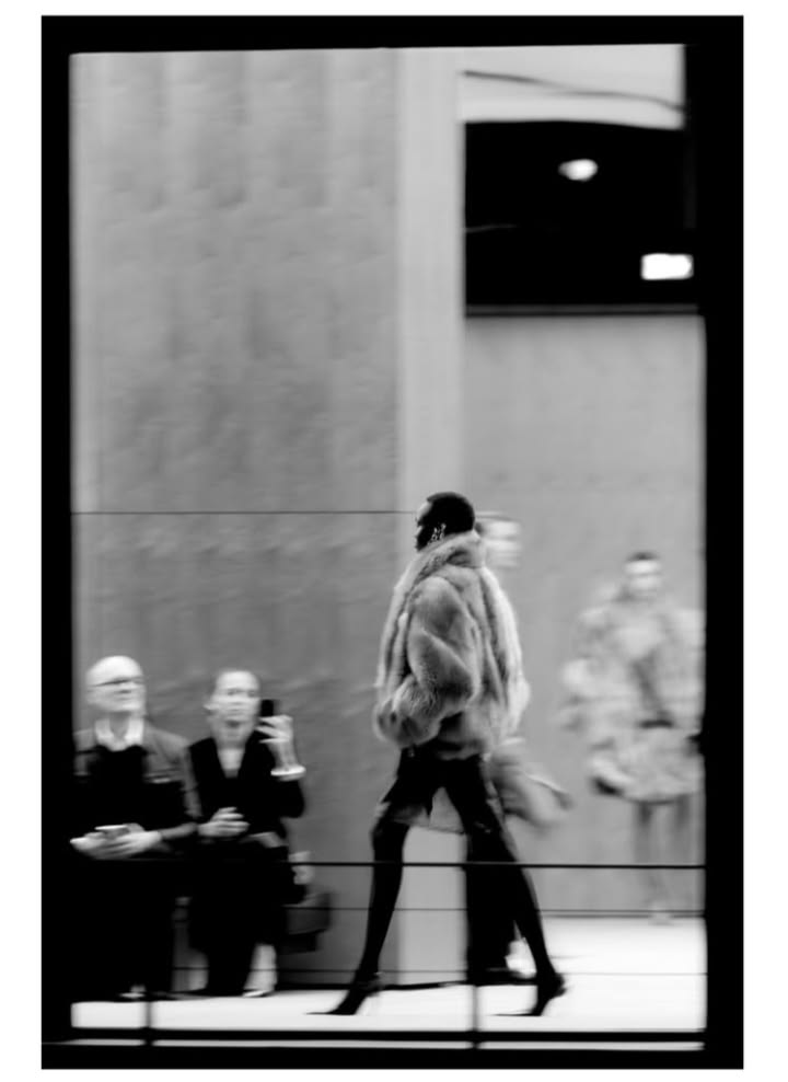 Saint Laurent Women’s Winter 2026 fashion show, with a silhouette in motion photographed in black and white.