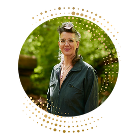 Portrait of Chavisa Horemans, trauma-informed divorce coach, coparenting coach, life transitions coach, and empowerment coach standing in the woods Vancouver., BC, Canada