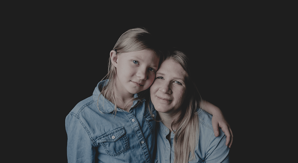 Mother and daughter smiling together