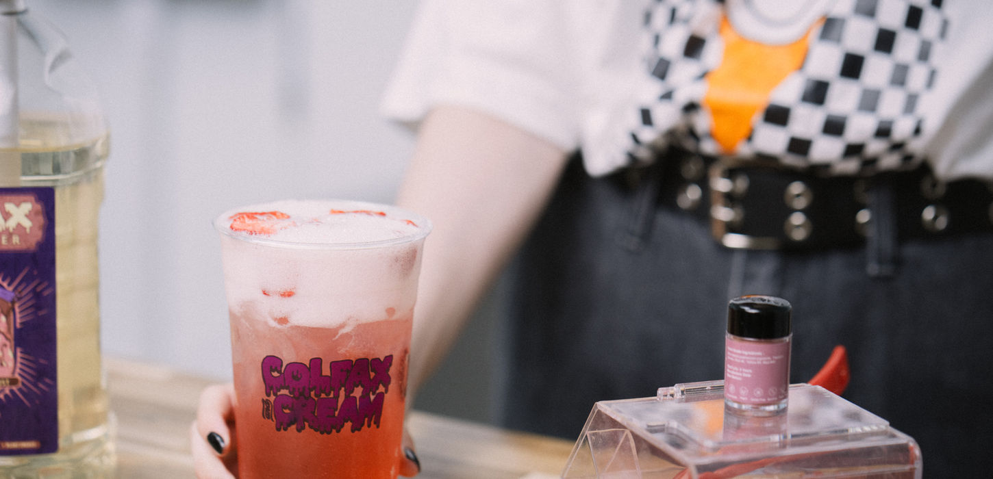 Woman holding Spooky Season drink
