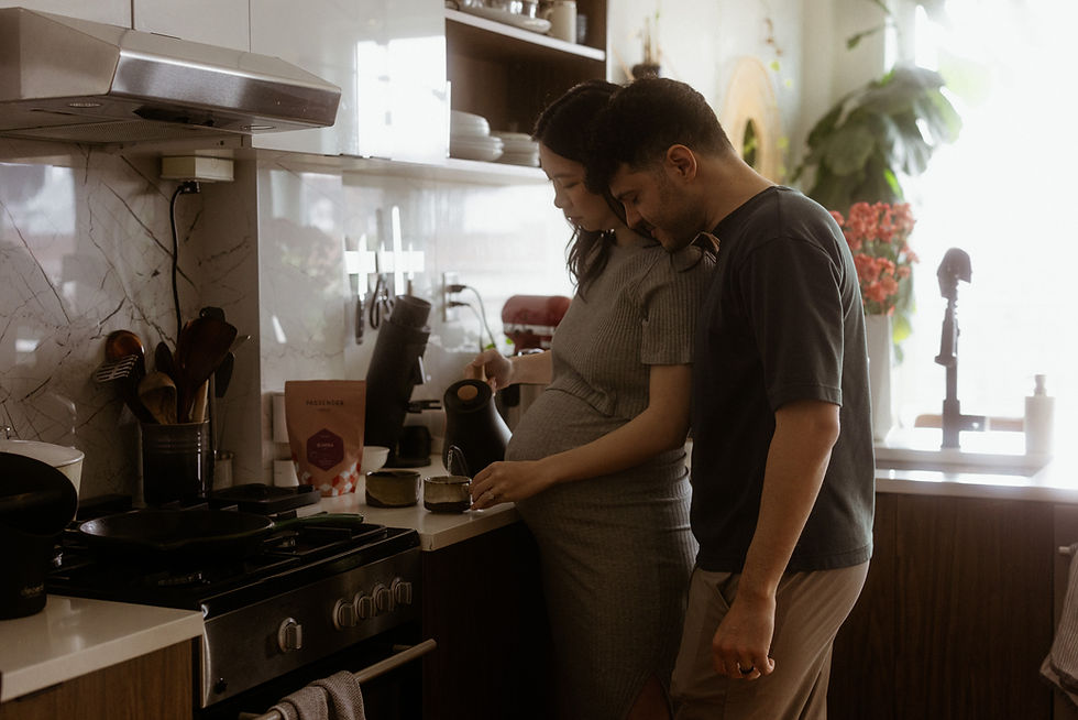 Digital photo emulating vintage film grain of couple in Brooklyn in-home maternity session