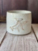 White handmade hug mug with gold line-drawn whale and calf impression
