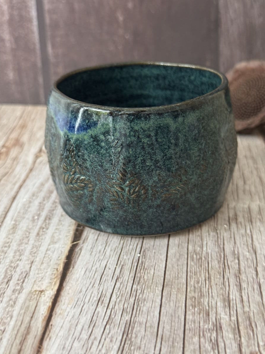 Dark teal wonky mug with tiny vines or fern impression