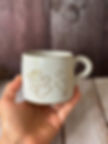White speckled clay mug with personalised paw print design