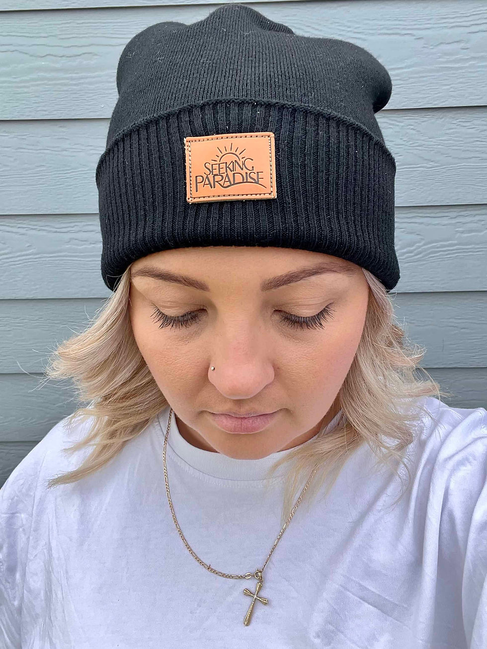 Thumbnail: Woman wearing a black slouch beanie.