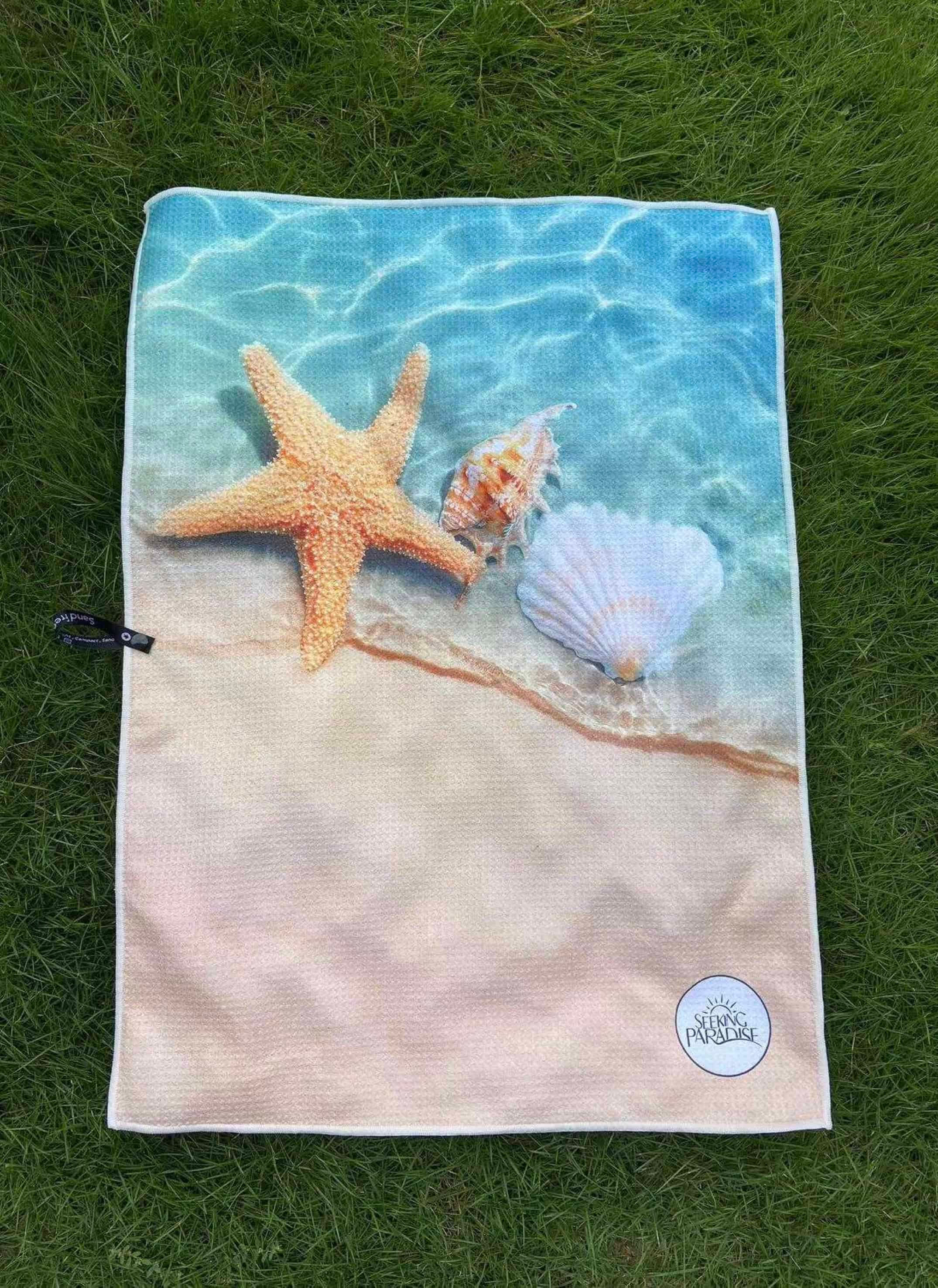 Microfibre tea towel with beach print.