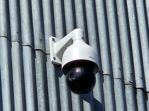 Pan tilt and zoom camera installed on a corrugated silver shed