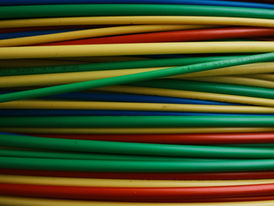 neatly organized stack of multicolored wires
