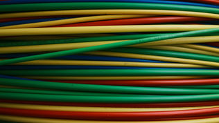 neatly organized stack of multicolored wires