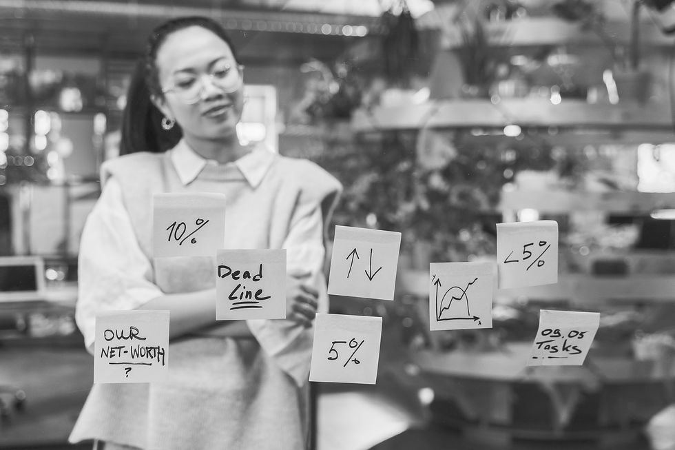 Asian woman looking at post its on glass window. Photo by AI25.Studio AI GENERATIVE: https://www.pexels.com/photo/woman-looking-at-sticky-notes-8279238/