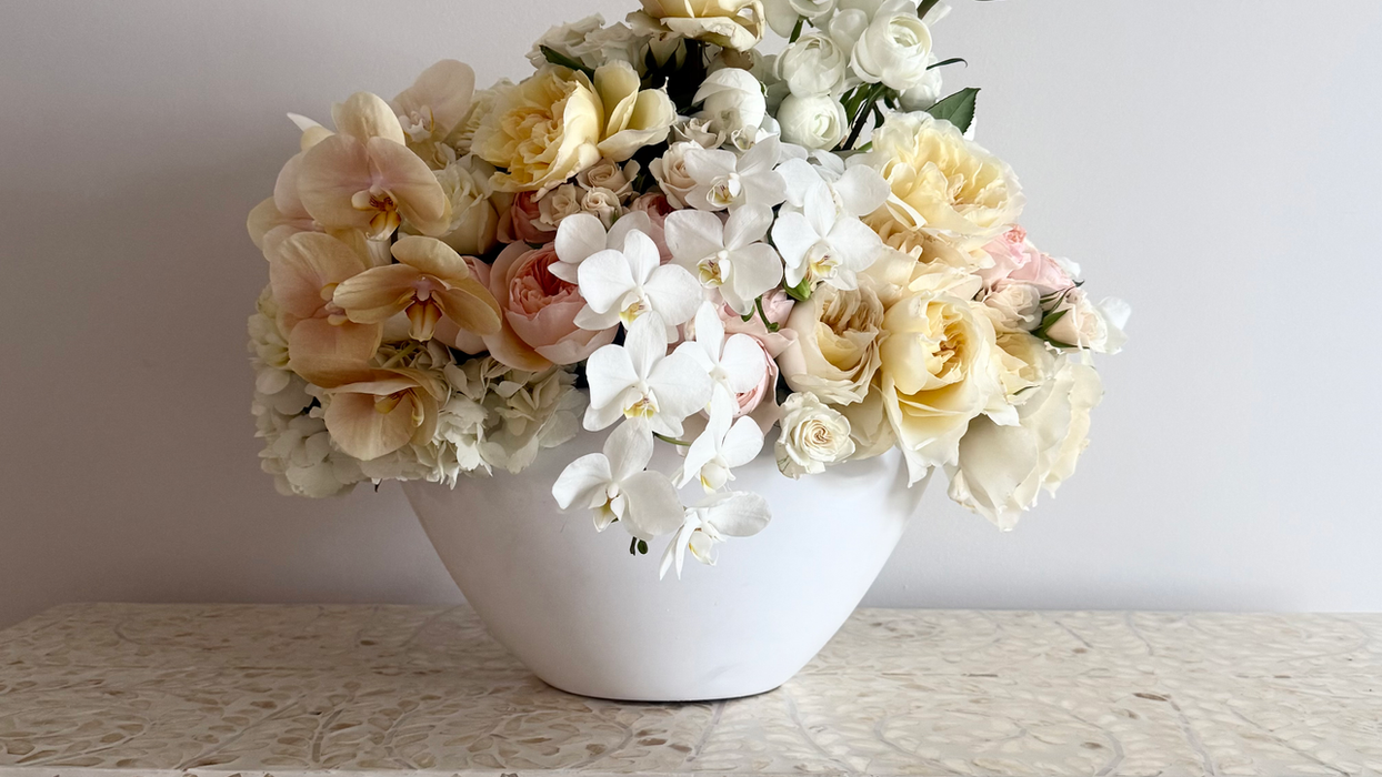 Luxury white Mother’s Day floral arrangement Miami with roses and orchids