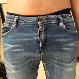 Packing with as-is packer, front view in tight jeans