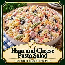 Ham and Cheese Pasta Salad with rotini, black olives, vegetables, and creamy dressing