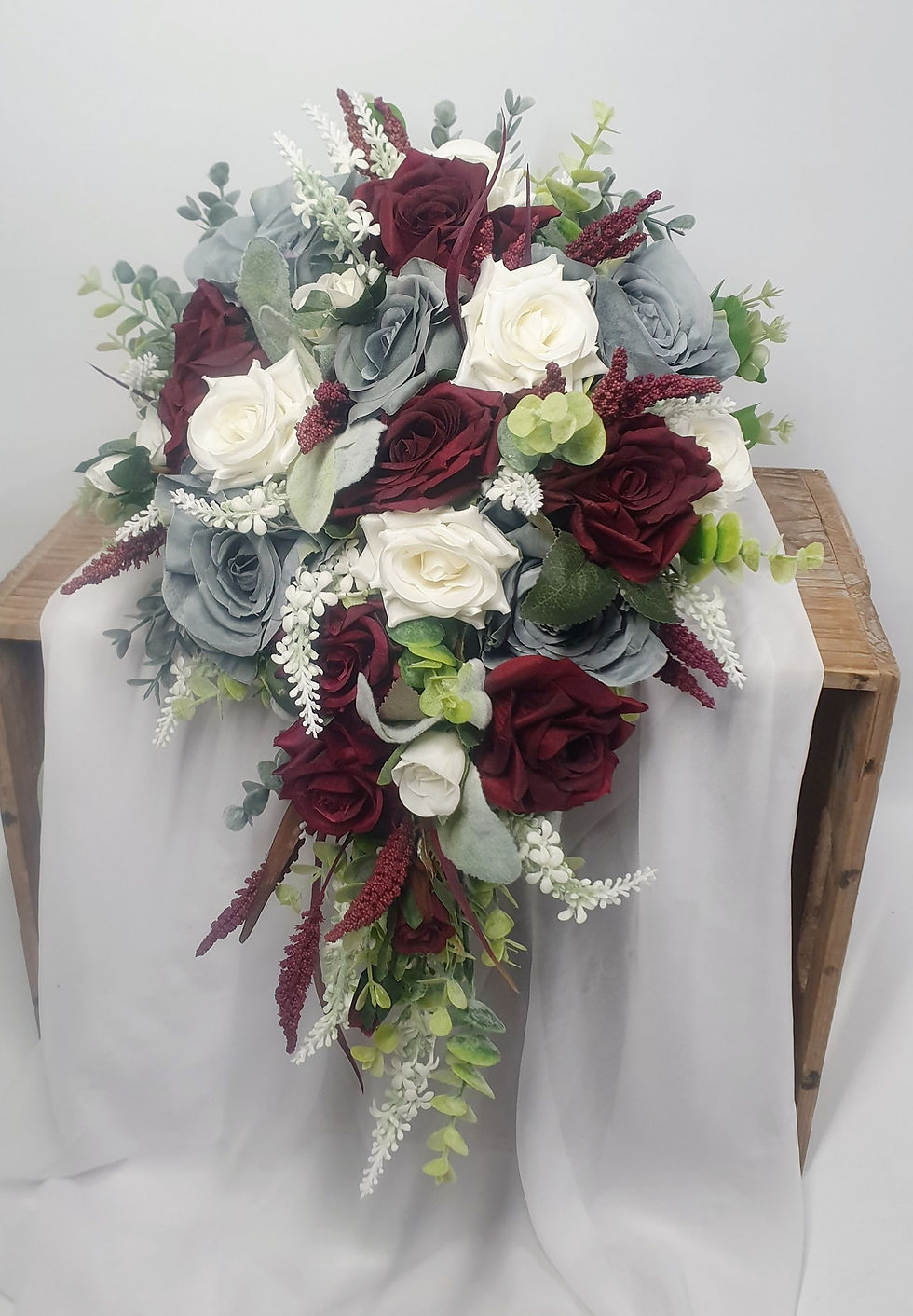 Thumbnail: Dusty Ruby Blue Bridal Bouquet
