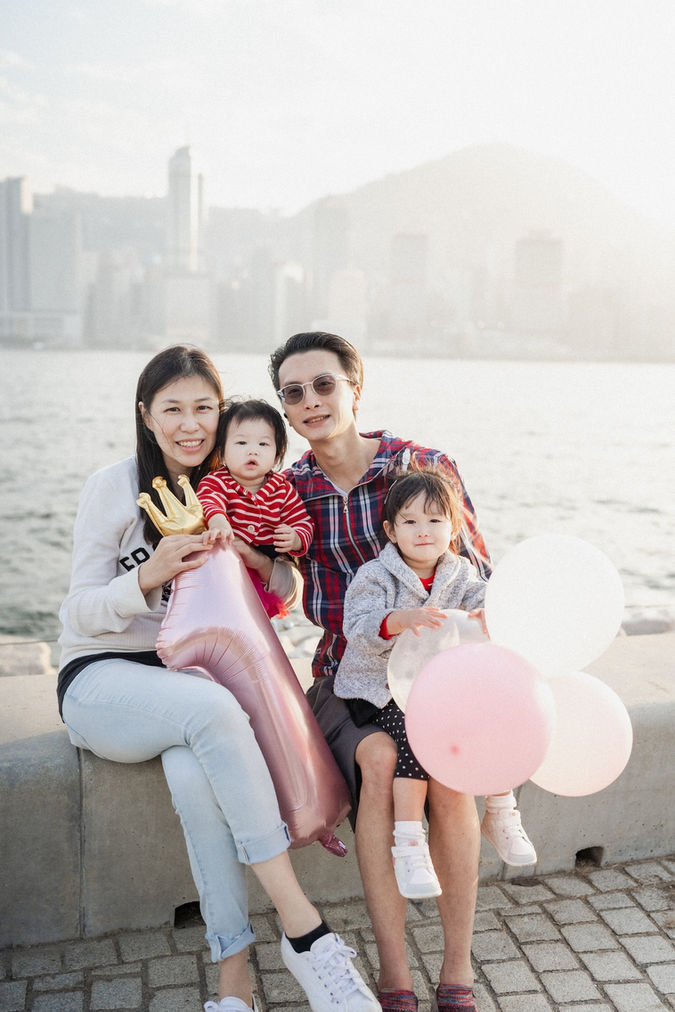 Hong Kong Family Photographer take pictures of family of four at West Kowloon Park in Hong Kong.