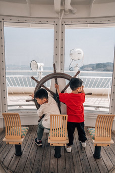 Two boys playing on the ferry to Shodoshima