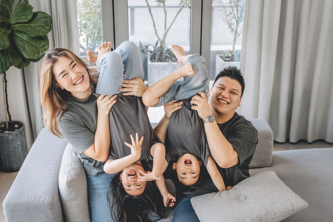 Hong Kong Family Photographer taking pictures of family of four  at home in Hong  Kong.