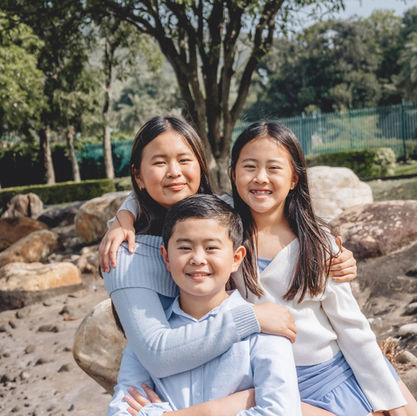 Hong Kong Family Photographer take pictures of family of three at Disney Inspiration Lake in Hong Kong.