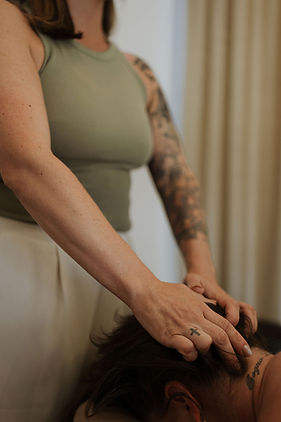 Therapeutic massage therapist performing deep tissue massage in Kansas City