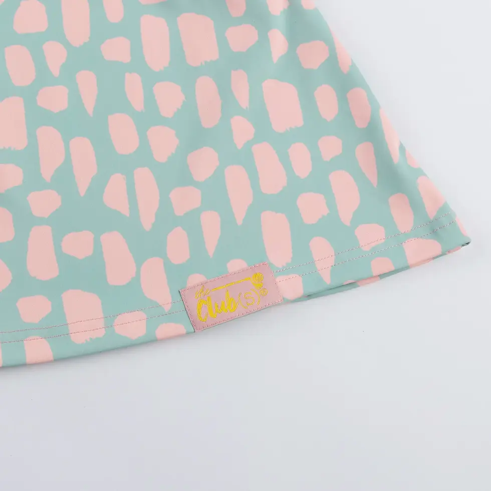 Thumbnail: Mint fabric with pink abstract pattern and small label