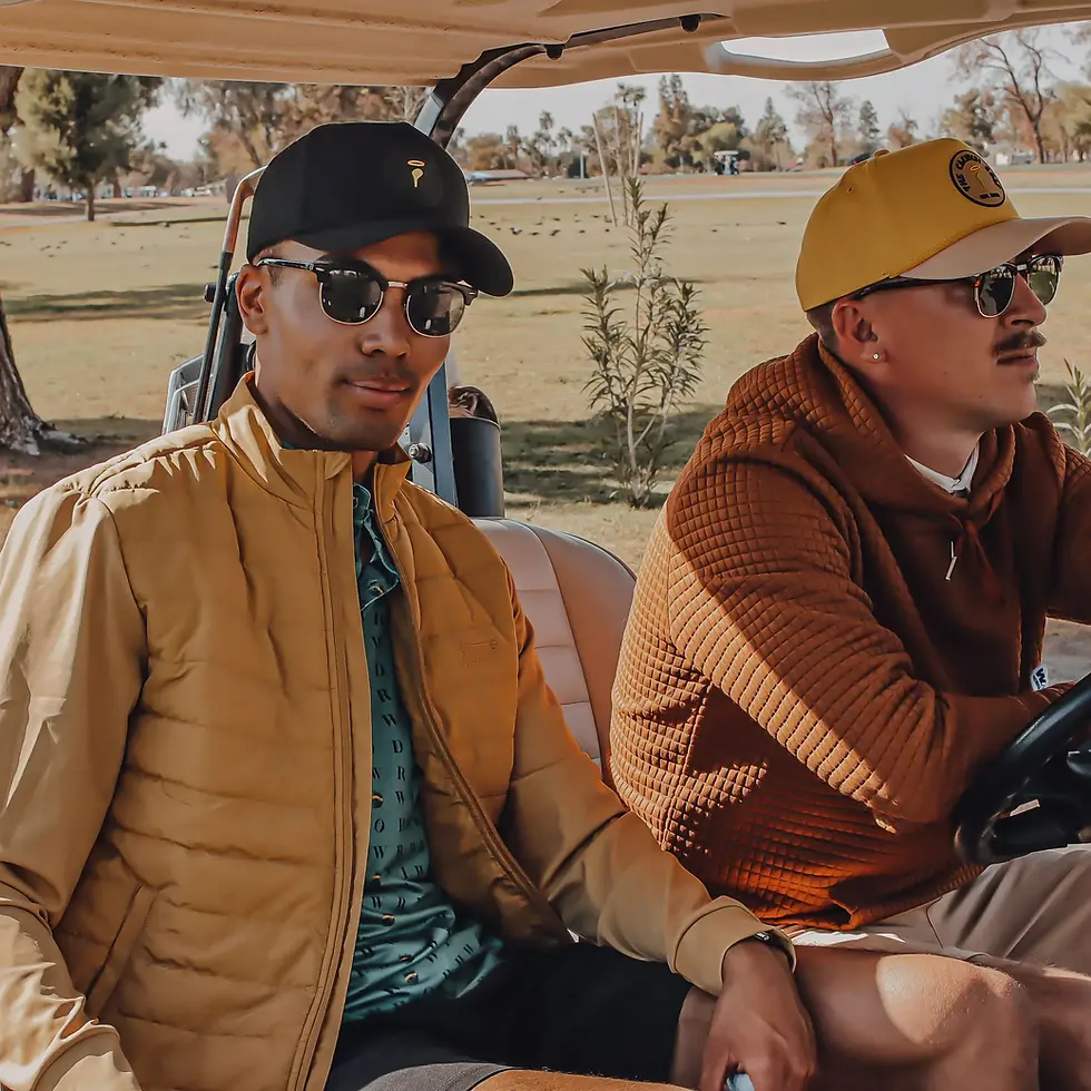 Thumbnail: Two men riding in a golf cart on a course