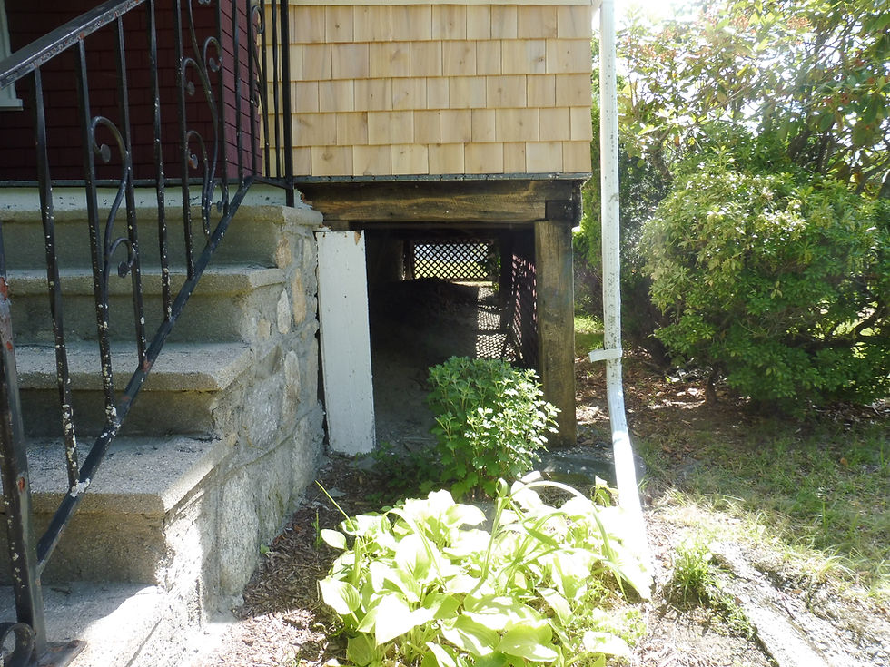 Original covered front porch on a 1920s New England bungalow inspected for age-related settlement and structural support conditions.