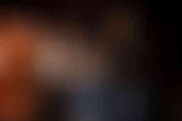 Donnie Gay, and Randy Schmutz looking at a plaque that was given to Donnie Gay