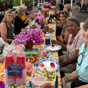 Tampa Orchid Club members sitting at a table at Orchids in Bloom for lunch