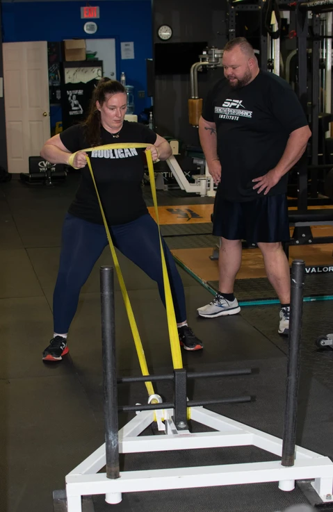 Donnie Kiernan, personal trainer at Strength & Performance Institute training a woman at t