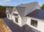 Sunny Daytime Drone Images of a Custom Home in the Final Stages of Construction. It Featur