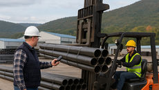 John Hannan scans barcode to track steel pipes in manufacturing yard