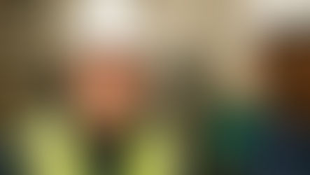 John Hannan works with a distribution warehouse employee to use a new handheld