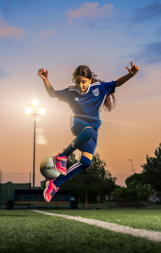 Young Girl Paying Football