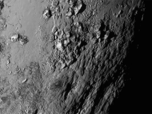 The Mountains and Makeup of Pluto