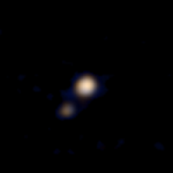 The First Color Photos of Pluto and Charon