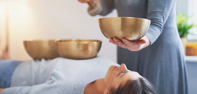 Woman having a Tibetan sound bowl massage.jpg