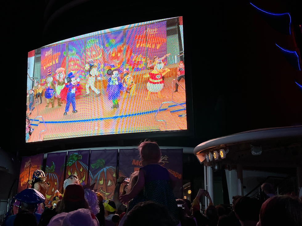 Enjoying the fun at Mickey's Mouse-querade party!