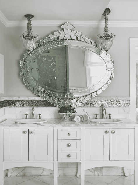 large mirror on white vanity