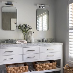 white organic bathroom with feminine sculpture, white vanity