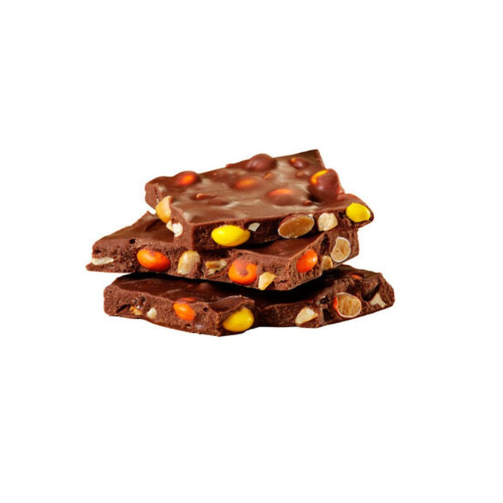 Thumbnail: Close-up of REESE'S PIECES milk chocolate bark pieces with peanuts and candy pieces