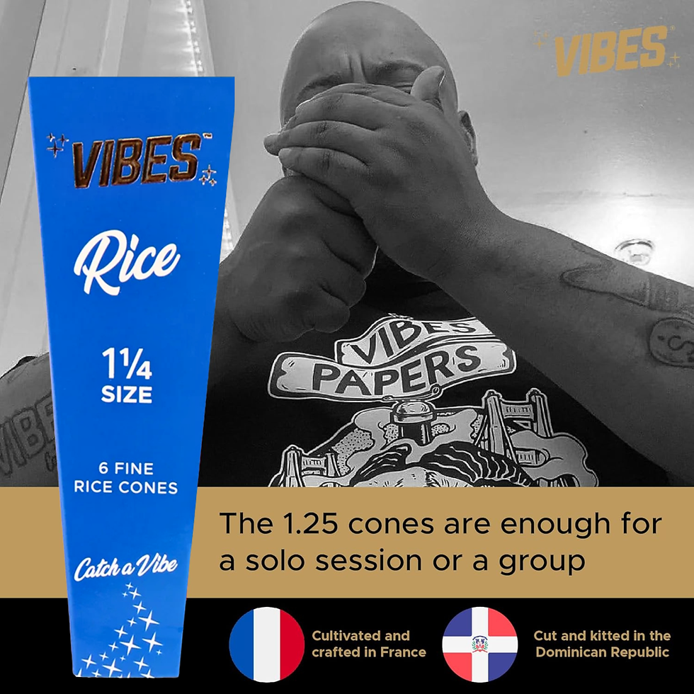 Thumbnail: Lifestyle image of a smoker smoking with Vibes Rice 1¼ cones shown on packaging