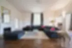 Elegant living room with sectional sofa, window, and decorative fireplace My Site 9