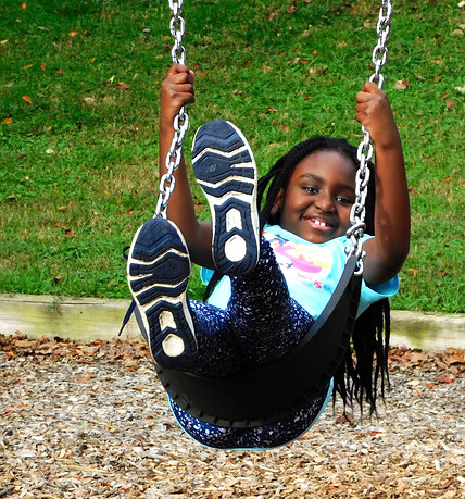 Paige on the swings.jpg