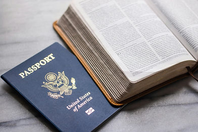 United States passport placed beside an open book, symbolizing immigration matters, legal documentation, and the personal experiences often involved in immigration evaluations. The image reflects support for asylum cases, hardship evaluations, VAWA petitions, U Visa applications, and other immigration-related psychological assessments.