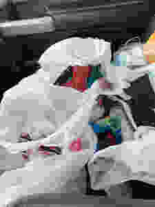 The bags filled with sewing supplies and finished masks that are distributed through an open window in my pickup