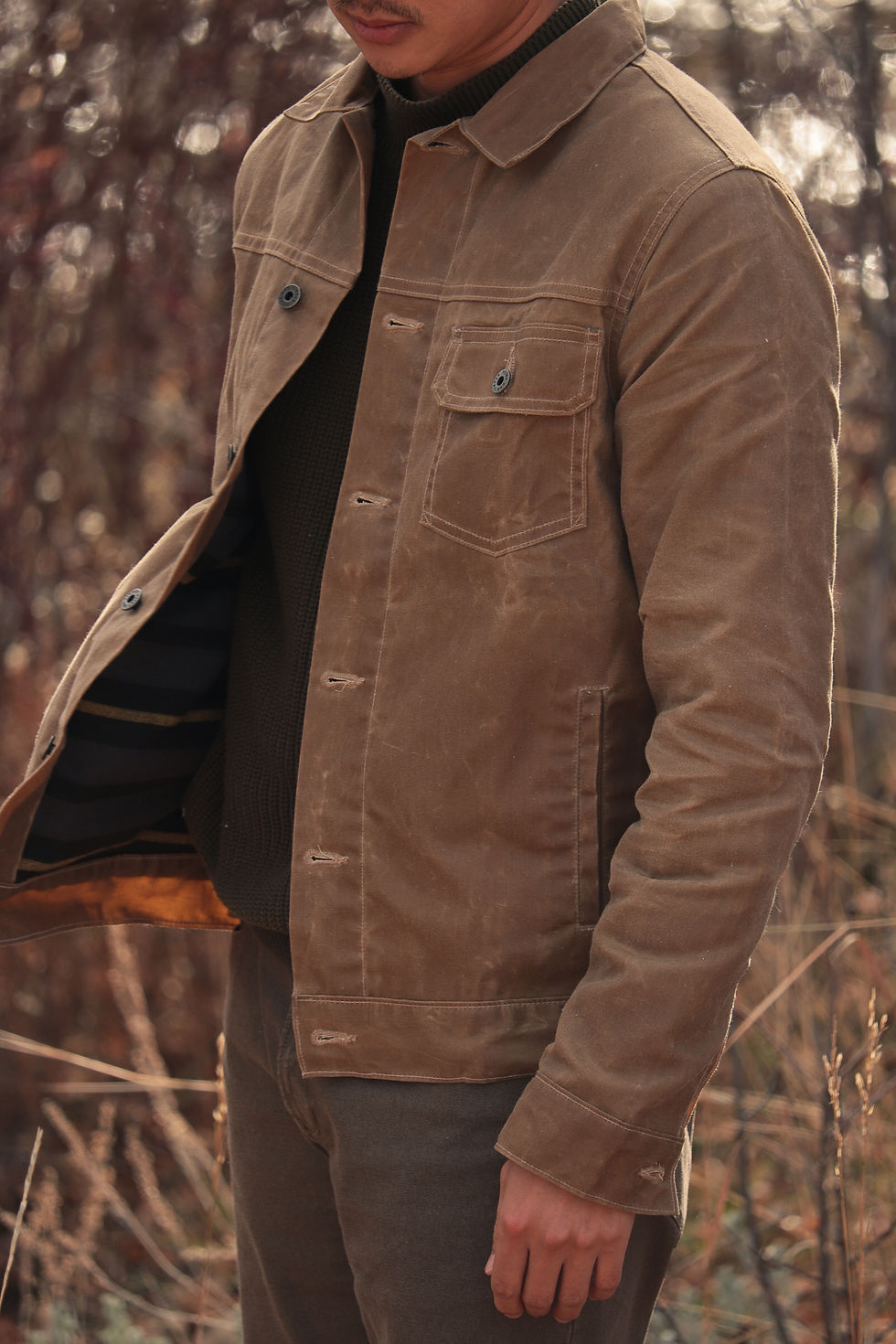 Topher Park wearing the Huckberry, Flint and Tinder Flannel-Lined Waxed Trucker Jacket (Field Tan/Small)