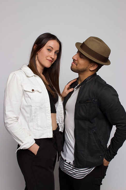 Photo of Abby and Erick Paul. Abby looking forward and Erick gazes at Abby.