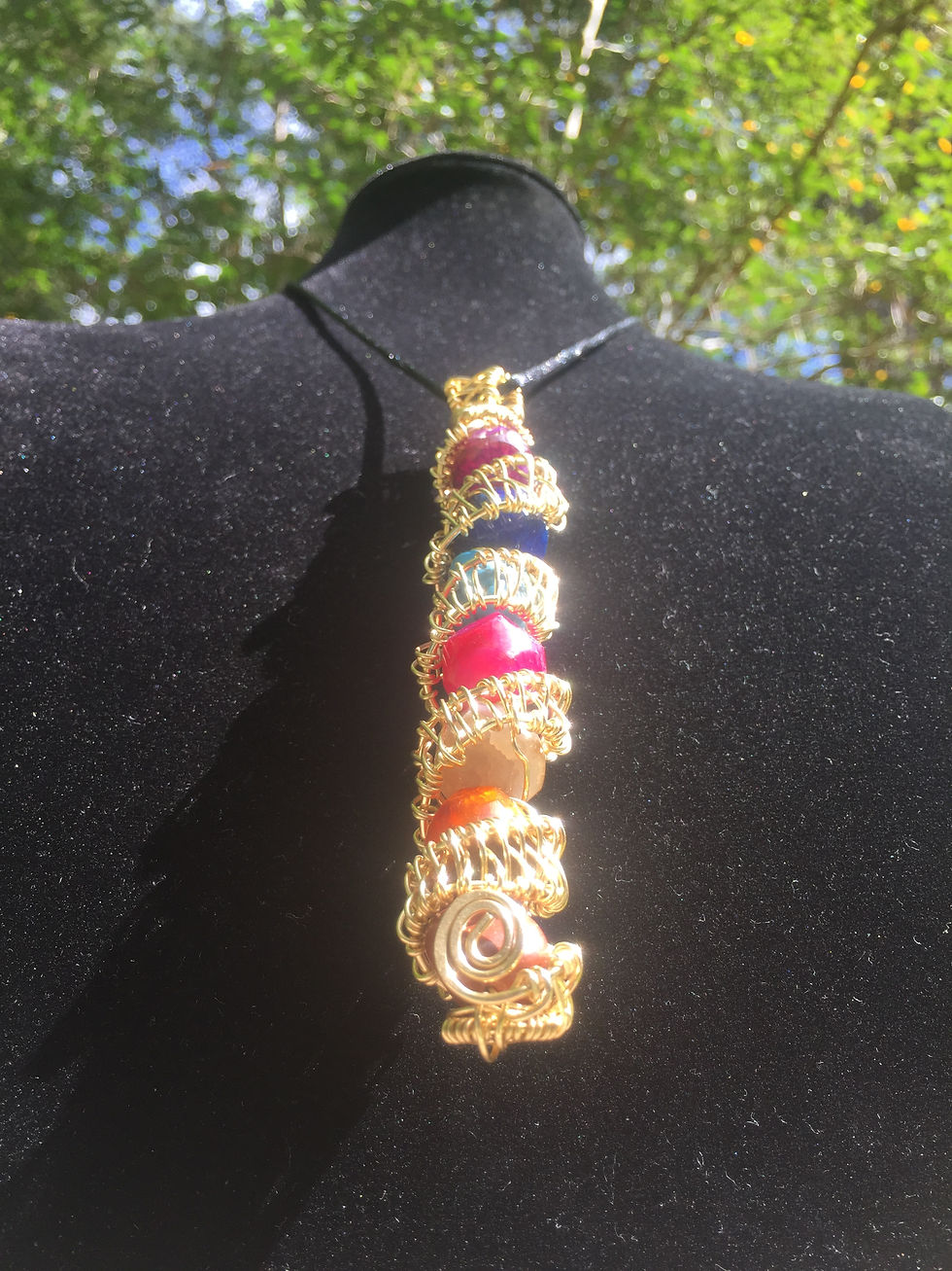 Thumbnail: Brass wire wrapped chackra amulet 