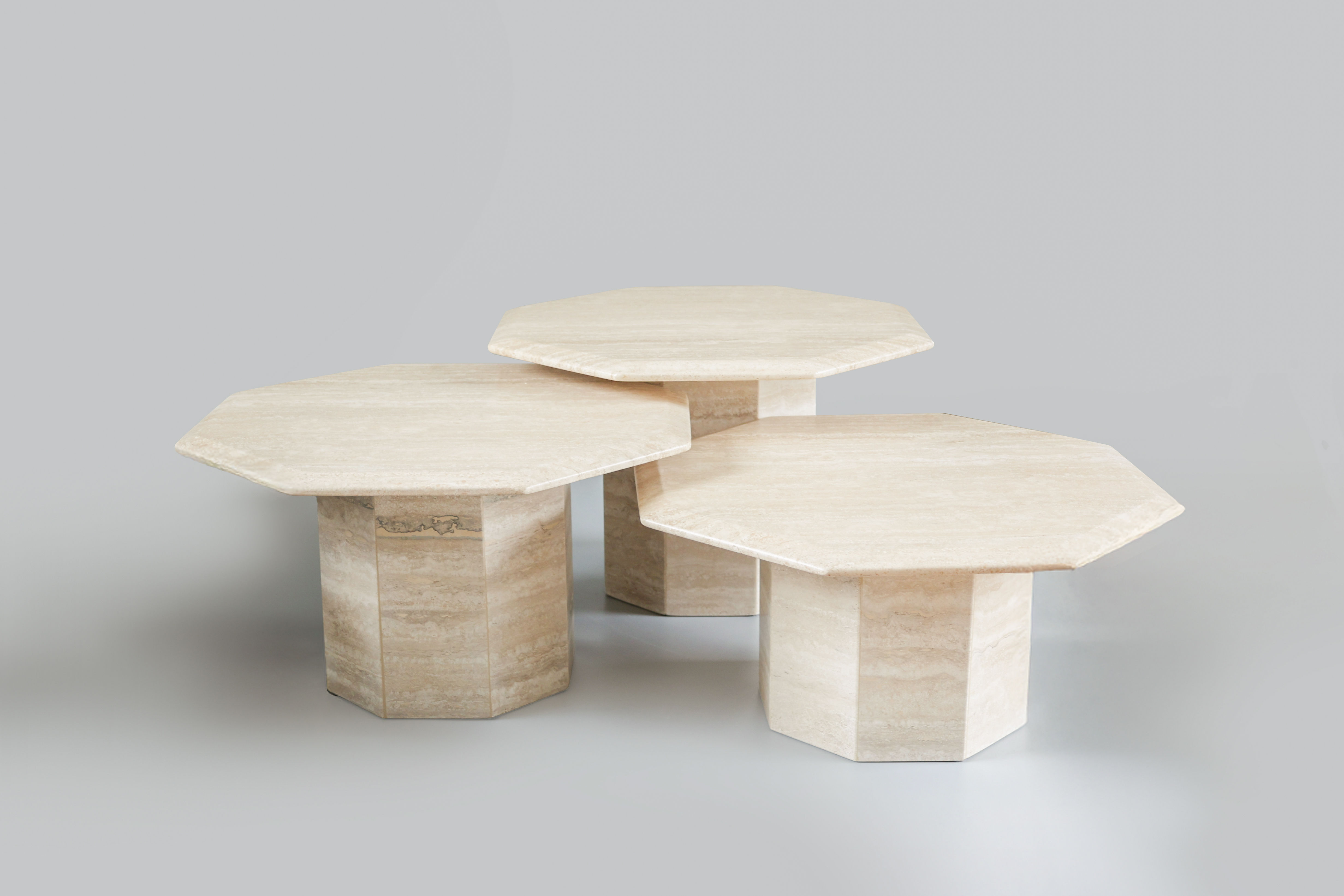 OCTAGONAL TRAVERTINE NESTING TABLES, 1970S.