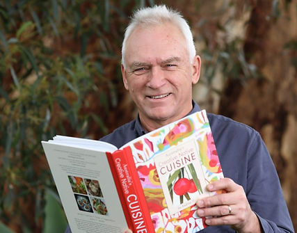 Andrew-with-book--scaled-e1596425509940.jpg